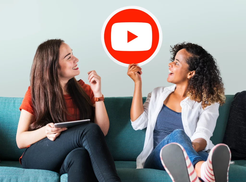 Women holding youtube icon